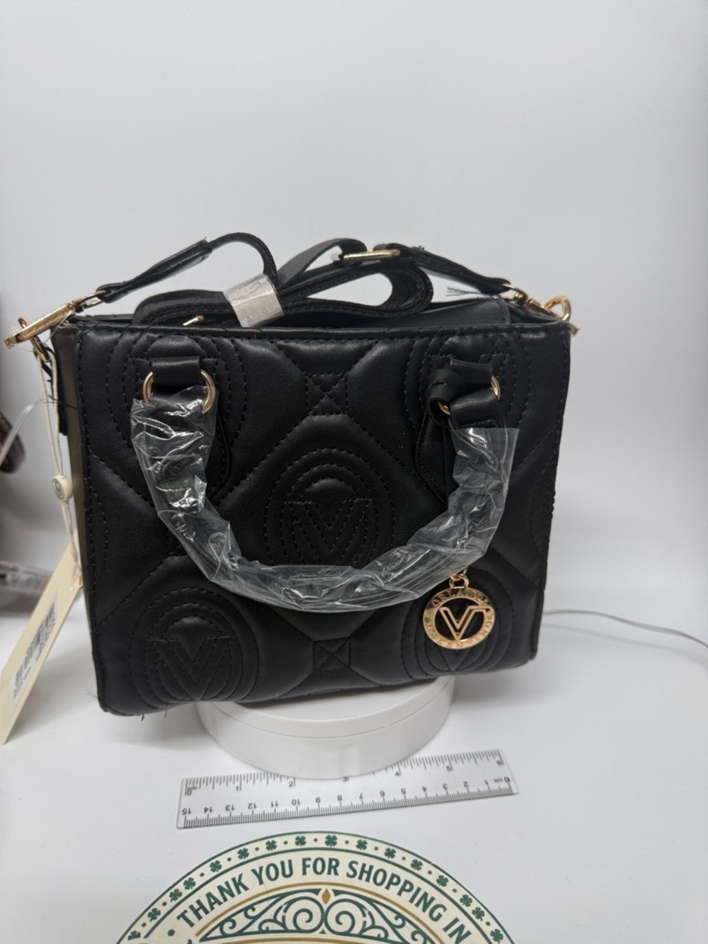 Black Quilted Mini Top-Handle Bag with Gold V Charm